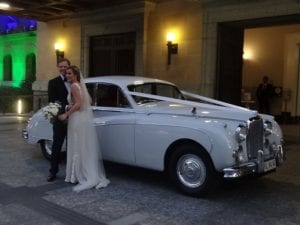 married couple with Jaguar Mk IX 1960
