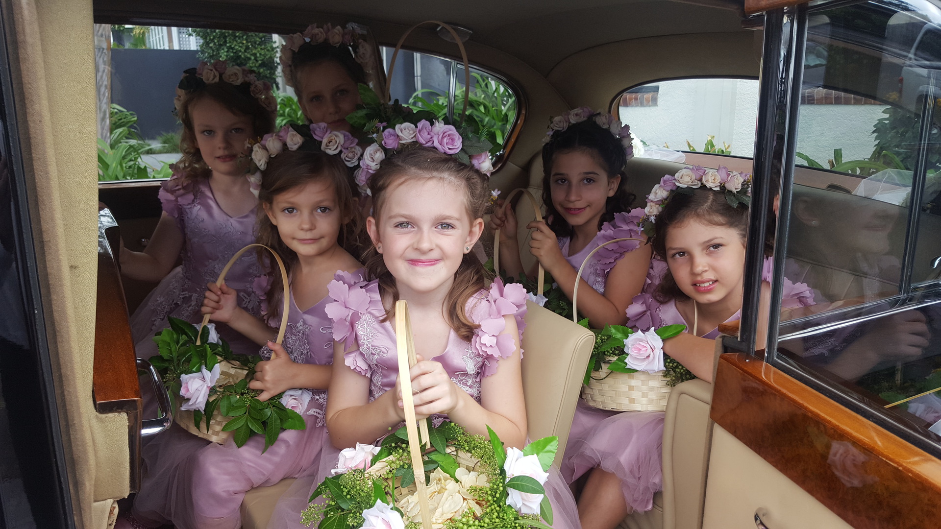 flower girls inside the vanden plas princess wedding car