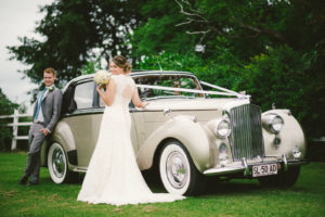 Bride next to 1950’s Classic Bentley