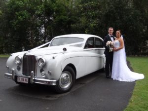 Jaguar Wedding Car with bride and groom