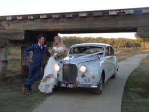 Jag Wedding car with bride & groom