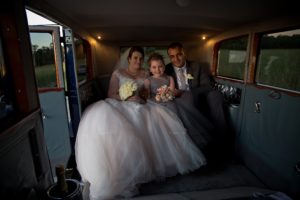 Bride sitting in Graham Paige 1929 Vintage wedding car